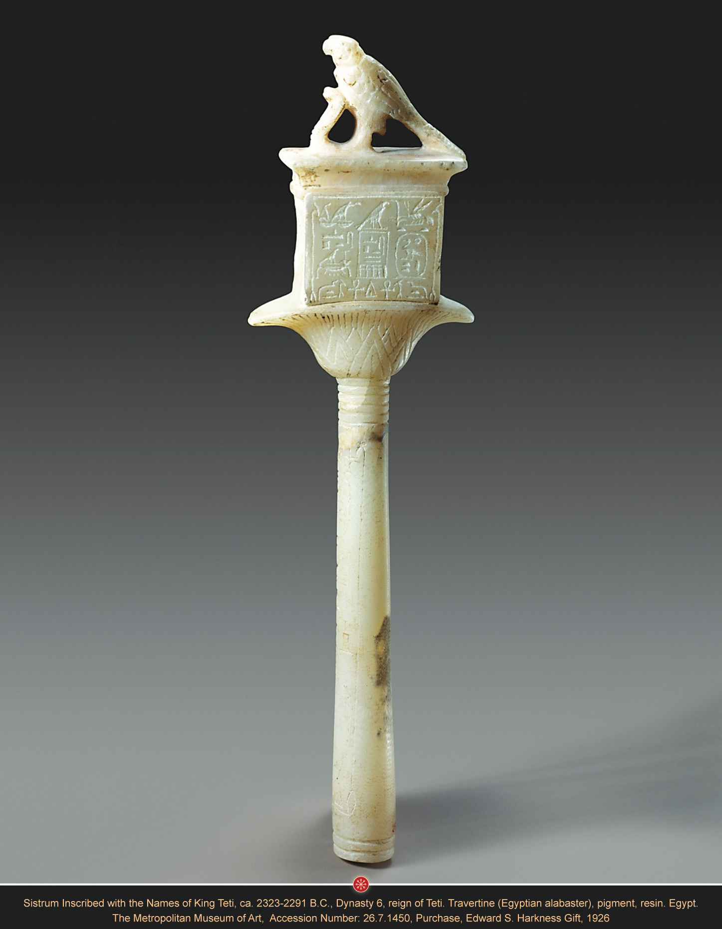 Alabaster Sistrum Inscribed with the Names of King Teti Ca. 2323-2291 B.C., Dynasty 6, reign of Teti. Travertine (Egyptian alabaster), pigment, resin. Egypt. H. 26.5 cm, W: 7 cm, D: 1,7 cm. The Metropolitan Museum of Art, Accession Number: 26.7.1450